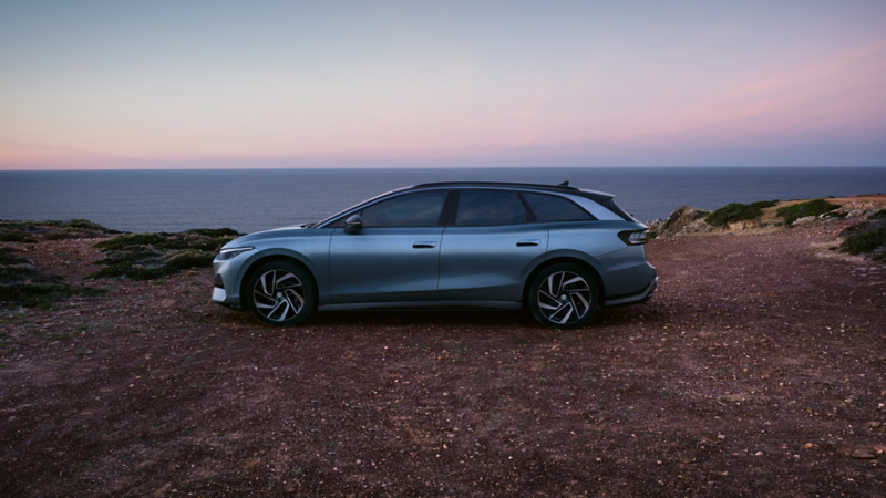 an ID.7 Tourer parked by the ocean