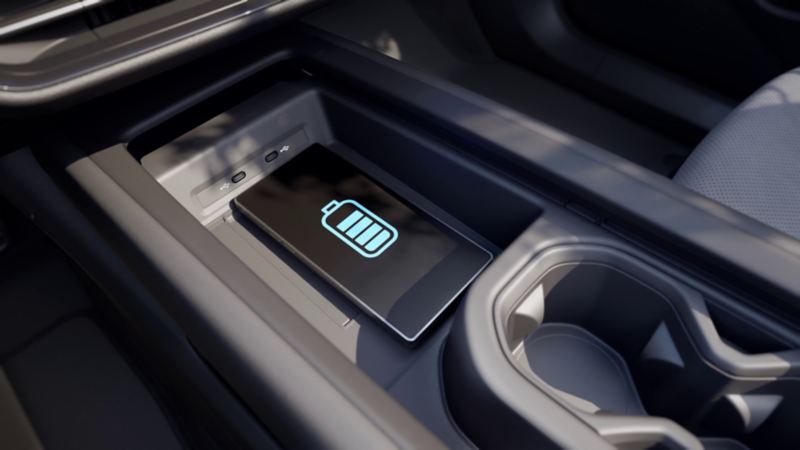 View of the ID.7 centre console, shows a smartphone charging