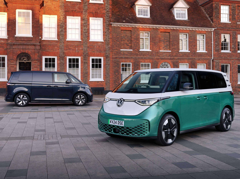 an ID. Buzz and ID. Buzz Cargo parked and charging at a public charger