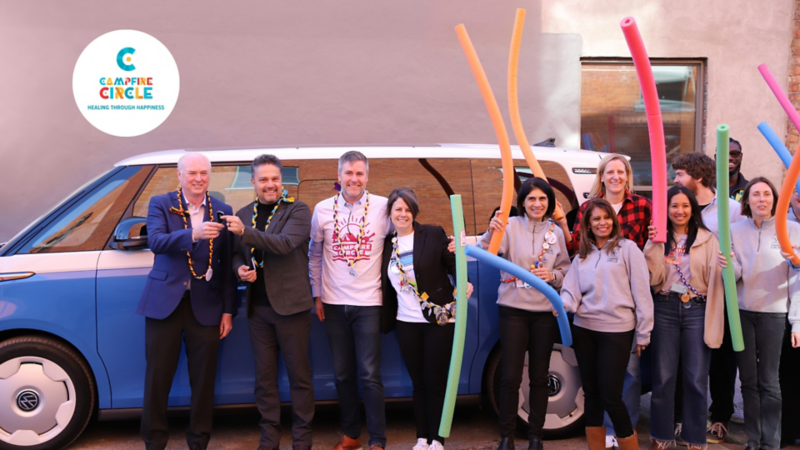 VW happily handing over the keys to the ID.Buzz auction winner with Campfire Circle staff
