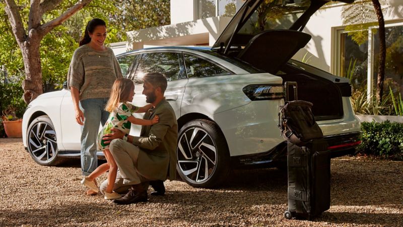 Family enjoying life with an electric car