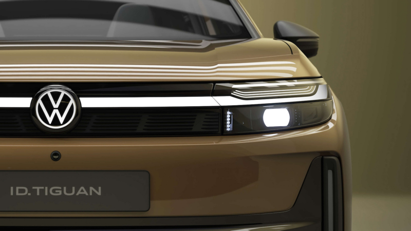 Close up front view of an olive gold ID. Tiguan with ID. Lights turned on
