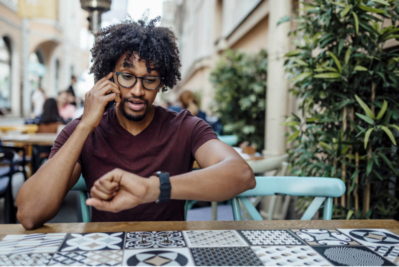 A man checking the time on his watch