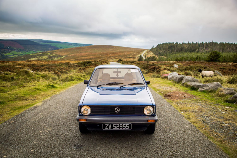 Volkswagen Blue MK1 Golf on Irish Countryside Road with Sheep