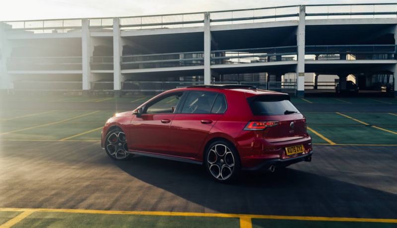 Rear three-quarter view of a red Golf GTI in a car park