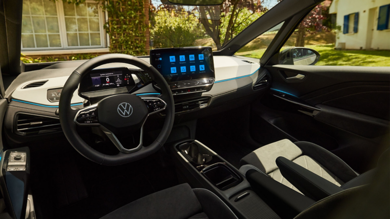 Vue intérieure avant de l'ID.3, photographiée depuis la banquette arrière.