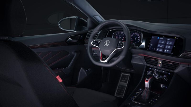 GLI 40 Aniversario. Interior de auto deportivo con vistas a volante, digital cockpit, acelerador y asiento de piloto.