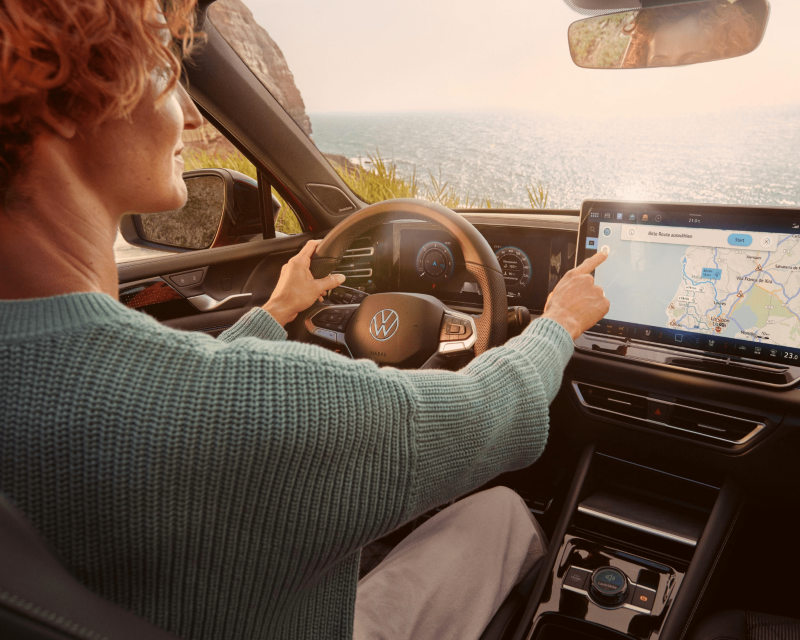 VW interior with navigation screen, perfect for adventures.