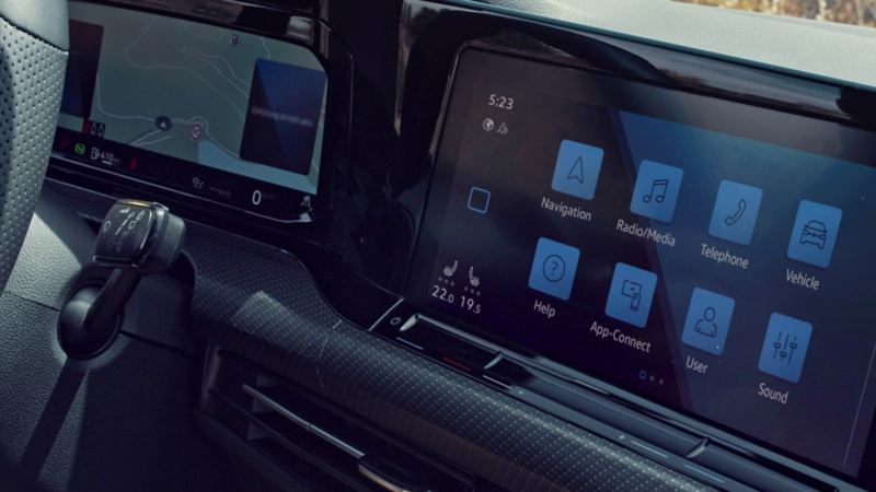 The interior of the VW Golf showing the Digital Cockpit Pro and optional navigation system with large touchscreen.