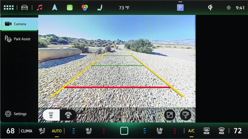 Volkswagen Driver Assist rear-view camera display showing parking guidelines, rear traffic alert, and light assist features.