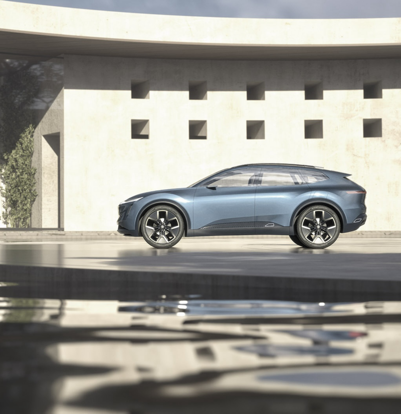 Picture shows the Volkswagen ID. CODE in front of a modern house next to a pool