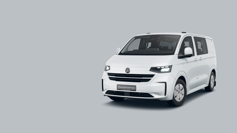 White VW Transporter Kombi parked against a grey background.
