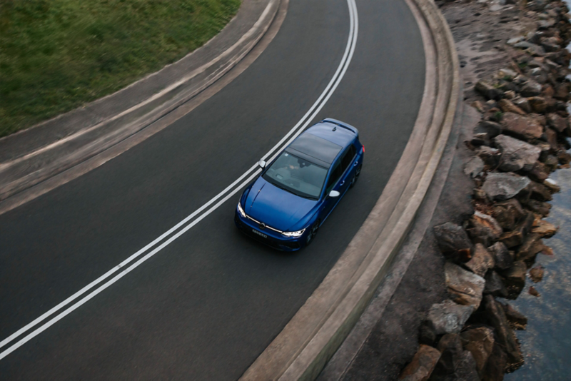 VW Golf R 2024 taking a bend by the water