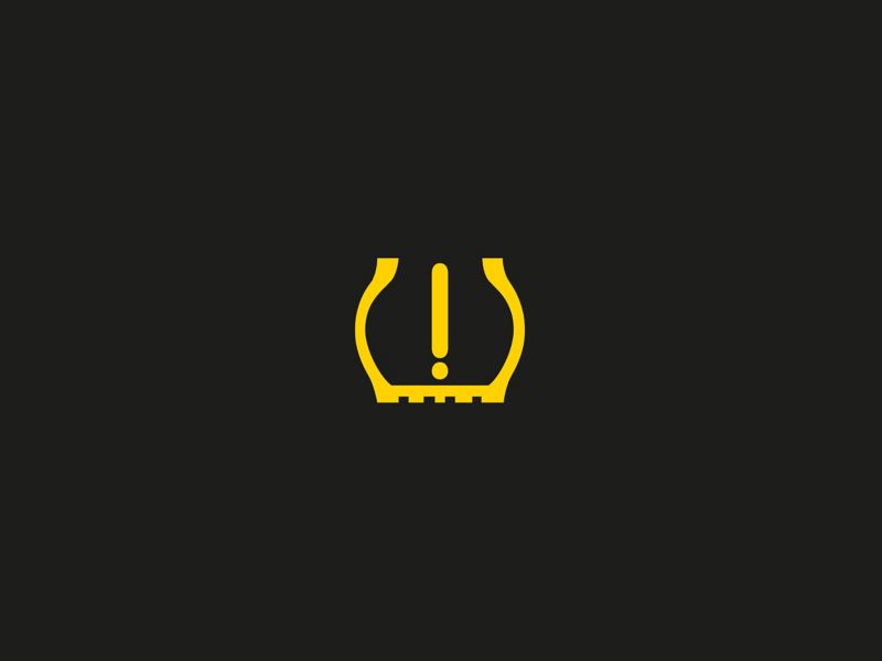 Yellow low tyre pressure warning light 
