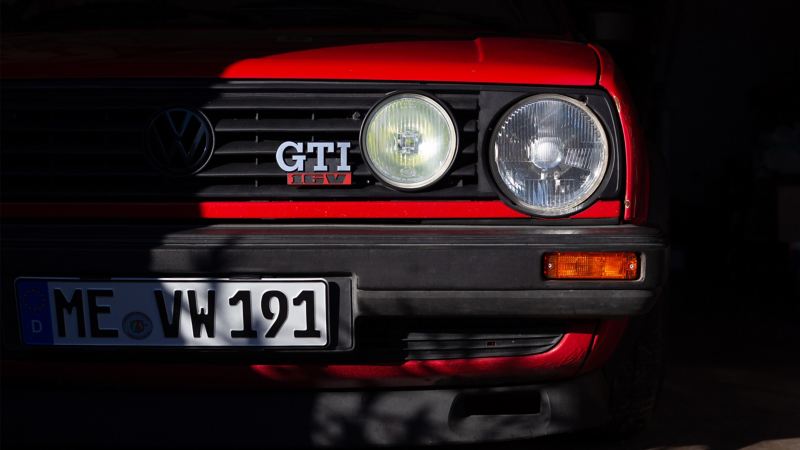 Close-up headlight of a VW Golf GTI