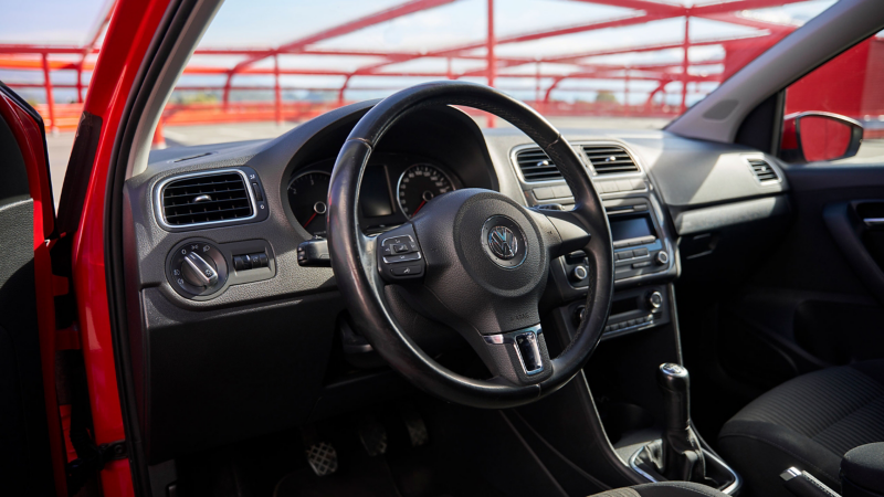 View of the cockpit of a VW Polo 5 through the open driver's door
