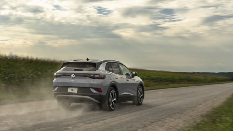 Electric SUV ID.4 2023 is driving on a scenic road