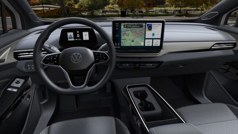 An interior of the 2024 Volkswagen ID.4 featuring steering wheel, dashboard, and ambient interior lighting