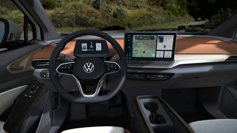 An interior of the 2024 Volkswagen ID.4 featuring steering wheel, dashboard, and ambient interior lighting