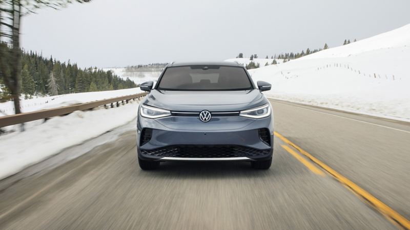 The front view photo of the 2024 Volkswagen ID.4 driving on the road during the winter