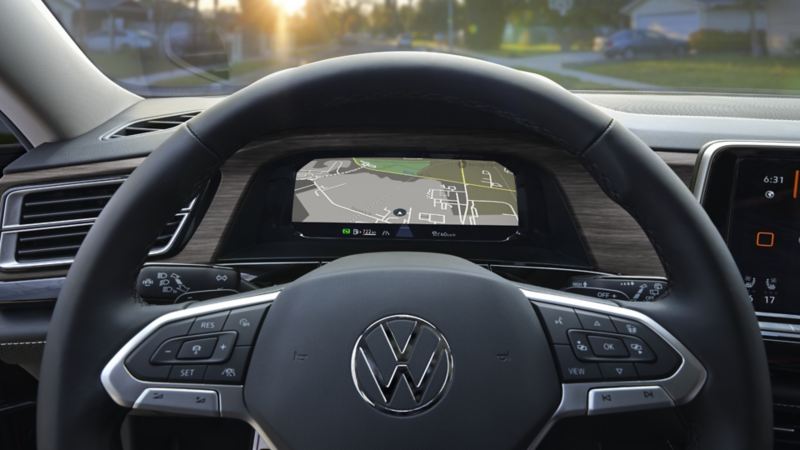 The interior of the 2024 Volkswagen Atlas featuring a steering wheel, dashboard  and front seats
