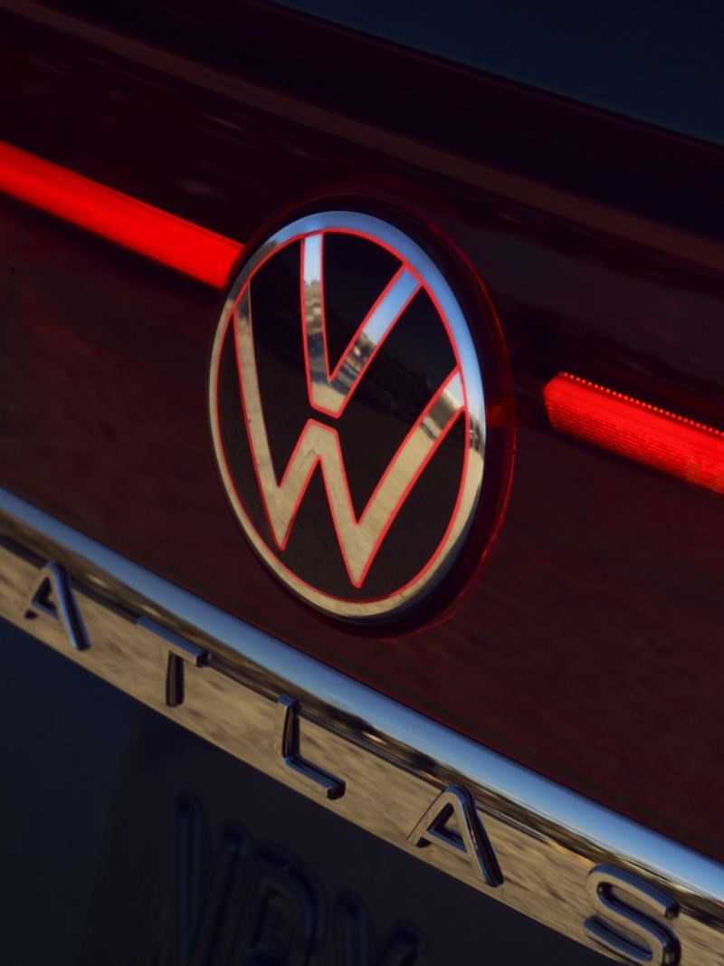 A close-up photo of the 2024 Volkswagen Atlas Cross Sport featuring logo and rear lights