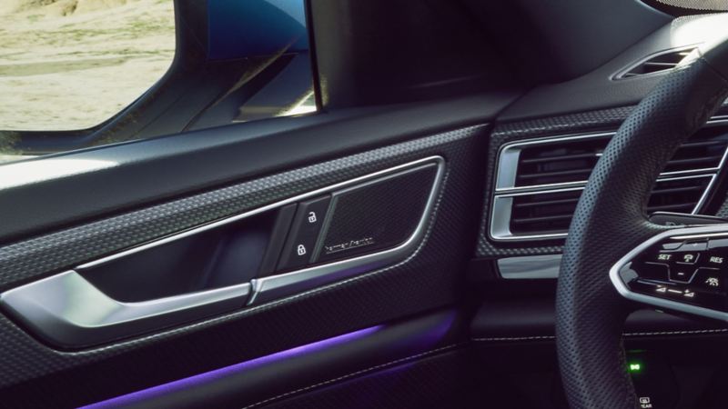 The interior of the 2024 Volkswagen Atlas Cross Sport featuring the Harman Kardon® Premium Audio system