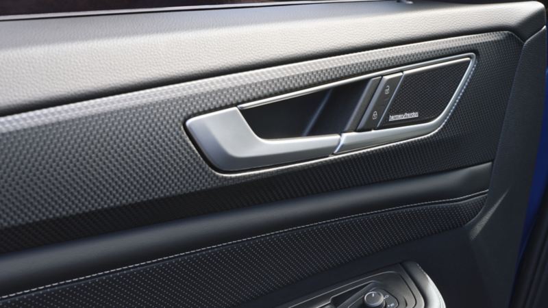 The interior of the 2024 Volkswagen Atlas Cross Sport featuring the Harman Kardon® Premium Audio system