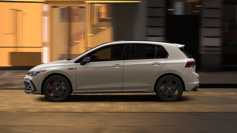 A side view of a Golf GTI driving down the road