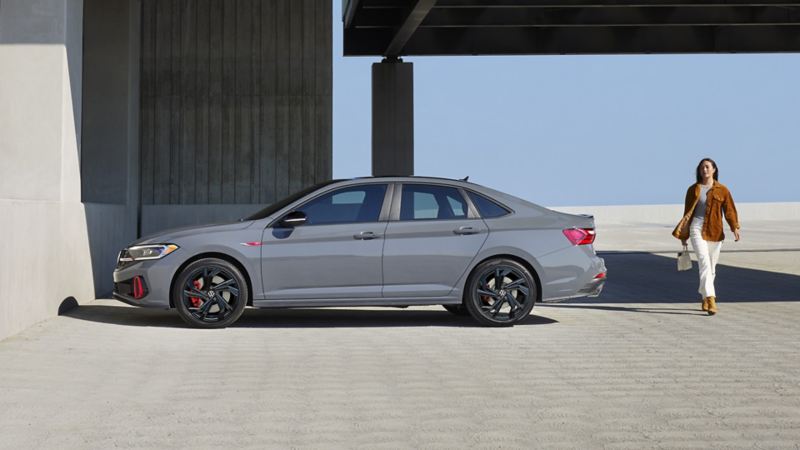 The 2024 VW Jetta GLI parked in an outdoor parking lot on a sunny day.