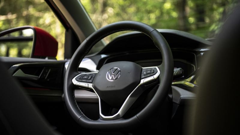 A close up photo of the standard leatherette steering wheel in the 2024 Volkswagen Taos
