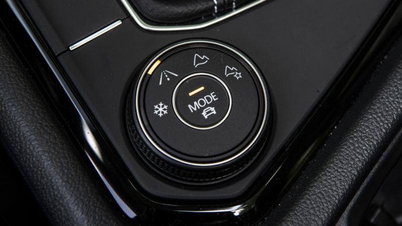 A close up photo of the customizable drive modes on the dashboard of the 2024 Volkswagen Taos