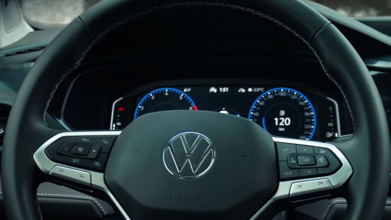 A close-up photo of a steering wheel and the 10.25” Digital Cockpit Pro in the 2024 Volkswagen Taos