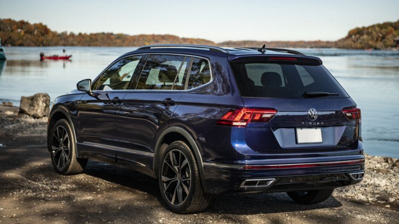 The blue 2024 Volkswagen Tiguan parked near a lake