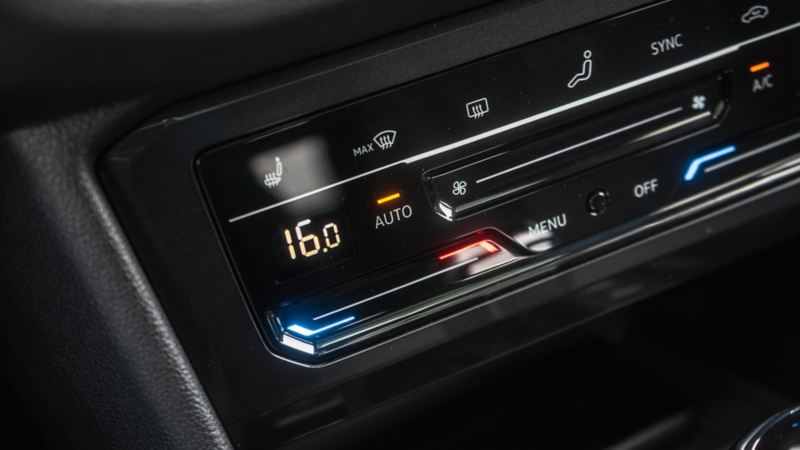 A close-up photo of the climate control and a three-zone Climatronic® system in the 2024 Volkswagen Tiguan