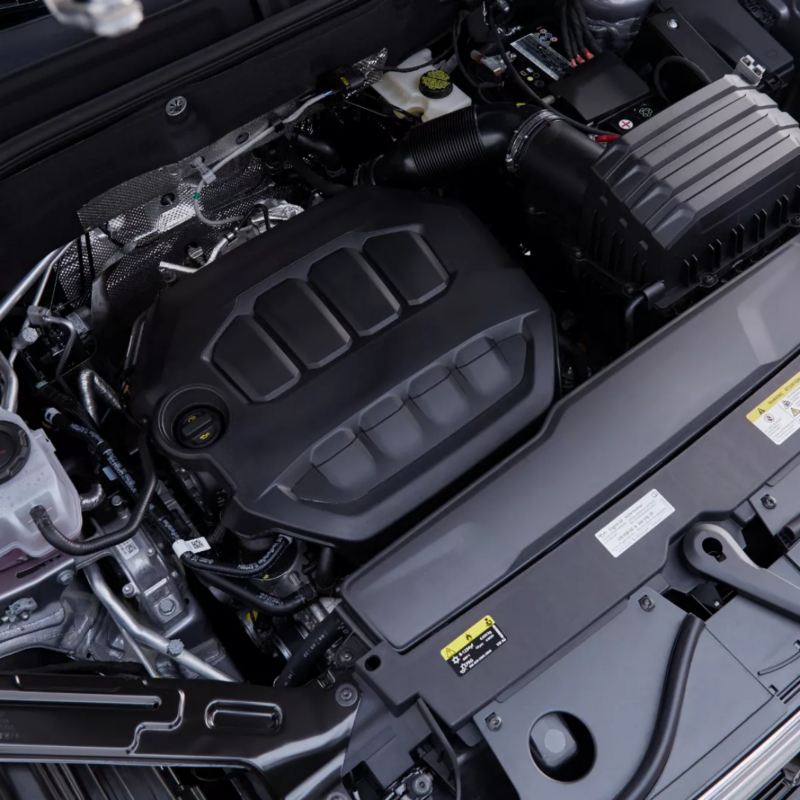 A detailed view of the engine compartment in a VW Atlas 2025, highlighting the intricate components and clean design.