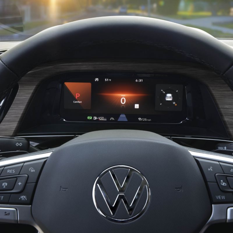 A close-up view of the VW Atlas 2025's steering wheel and digital dashboard, showcasing its advanced technology with a clear display of speed, gear position, and other key vehicle indicators.