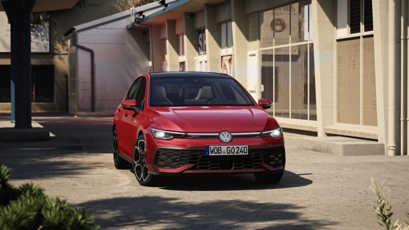 Volkswagen Golf GTI 2025 rouge, avec des accents de pinstripe rouges et des tuyaux d'échappement doubles.