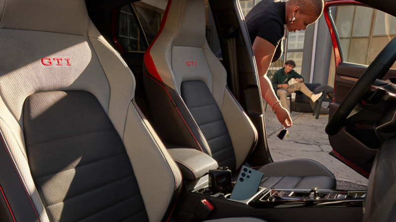 Sporty interior of a Volkswagen Golf GTI featuring comfortable seats.