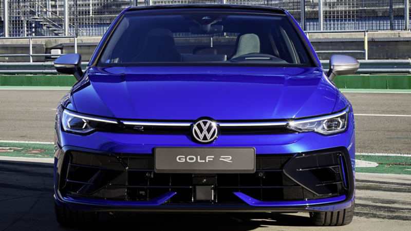 Blue Volkswagen Golf R at a racetrack.