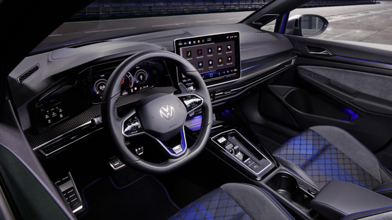 Driver's-side view of the Volkswagen Golf R's interior, showing the steering wheel and dashboard