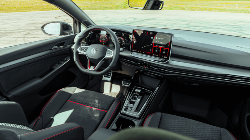 Collage of the 2026 Volkswagen Golf GTI featuring exterior views, interior cabin, front seats, steering wheel, touchscreen, and alloy wheel with red brake caliper. 