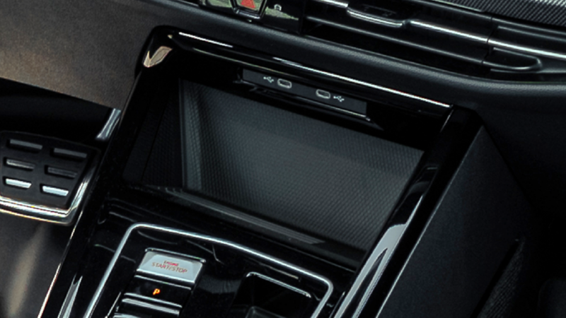 Wireless charging pad in the 2026 Volkswagen Golf GTI center console with USB-C ports above. 