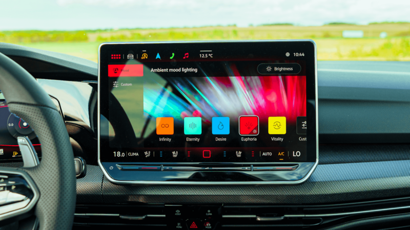 Interior of a 2025 Volkswagen Golf R, featuring a modern dashboard, steering wheel, and comfortable seating.