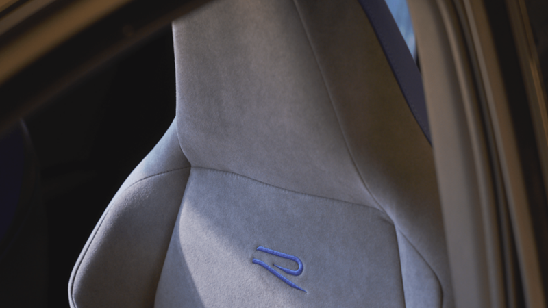 A woman sitting in a Volkswagen Golf R seat.