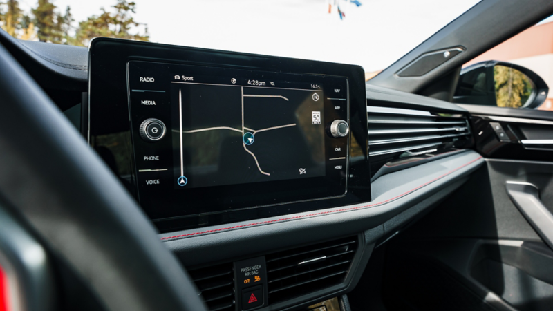 Jetta GLI infotainment screen displaying navigation map integrated into the dashboard. 