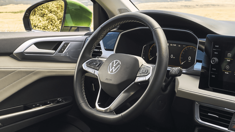 Close-up of the standard heated leatherette steering wheel in the 2026 Volkswagen Taos.