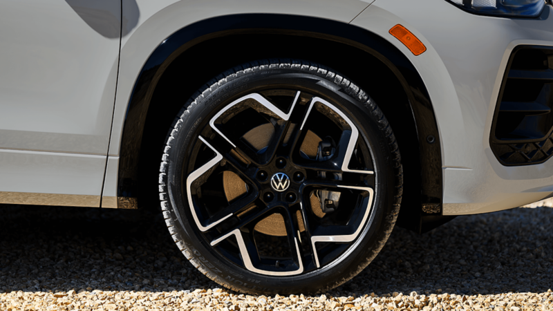 Close-up of the 2026 Volkswagen Tiguan SUV wheel with black and silver alloy rim.