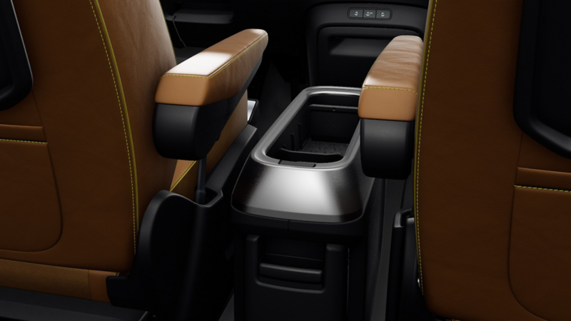 Close-up of the interior centre storage compartment between the front seats in a Volkswagen ID. Buzz.