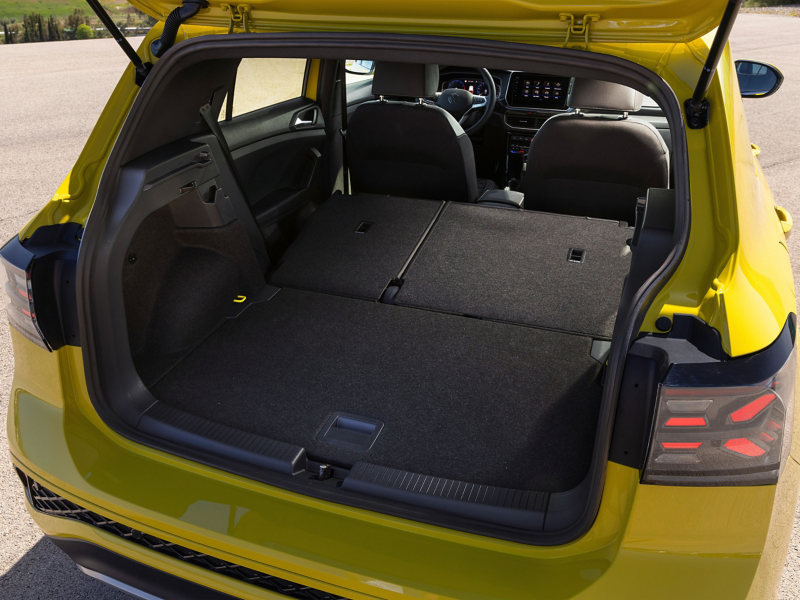 Yellow Volkswagen T-Cross boot space with seats in forward position.